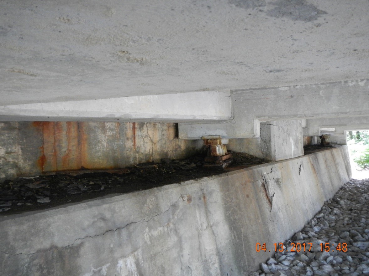Concrete abutment before debris removal