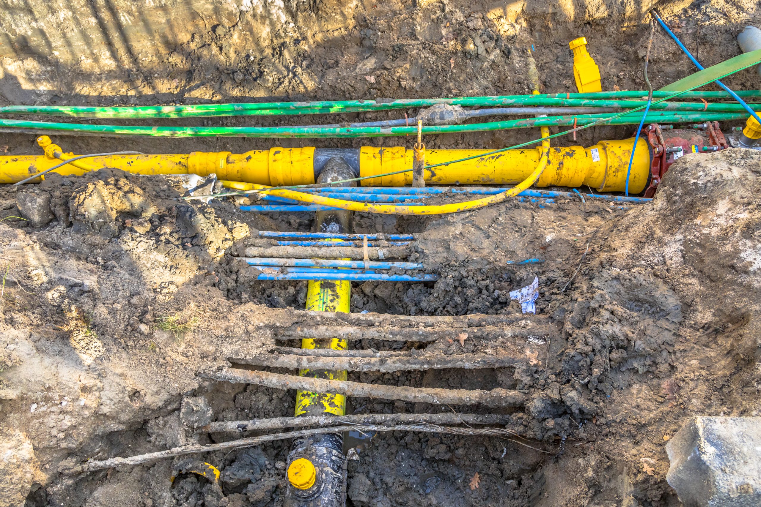 cables, pipes and sewage under pedestrian walkway